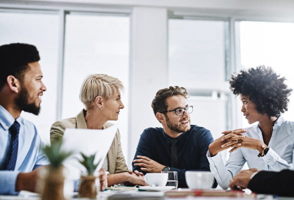 Professionals in a meeting, exchanging ideas and collaborating on projects