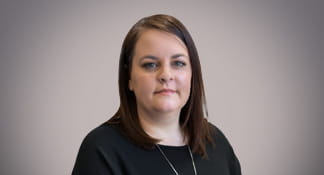 Headshot of lady wearing black jumper