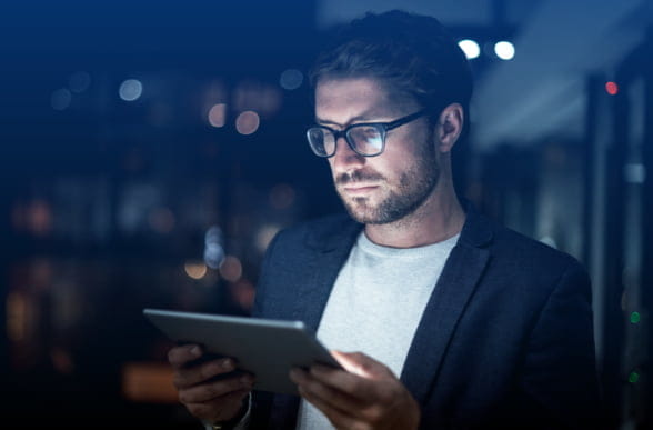 Trader looking at Forex app on a tablet